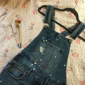 Denim stressed overalls.